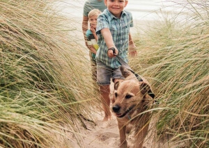 Happy family Walk with Raw Fed Dog